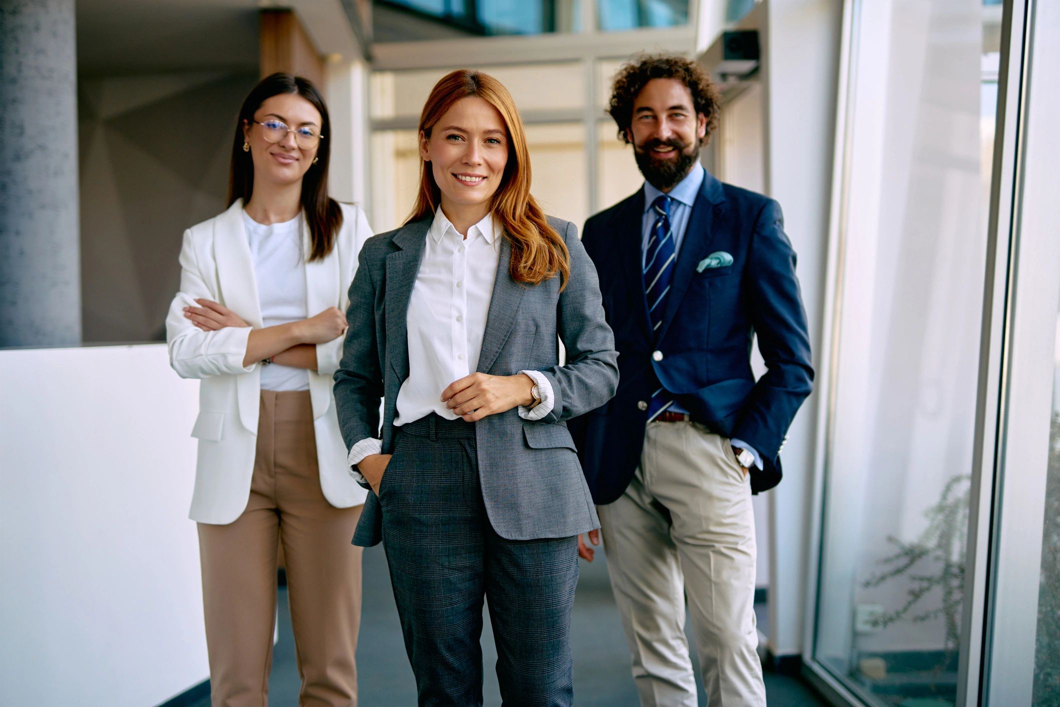Small team standing together in a modern office